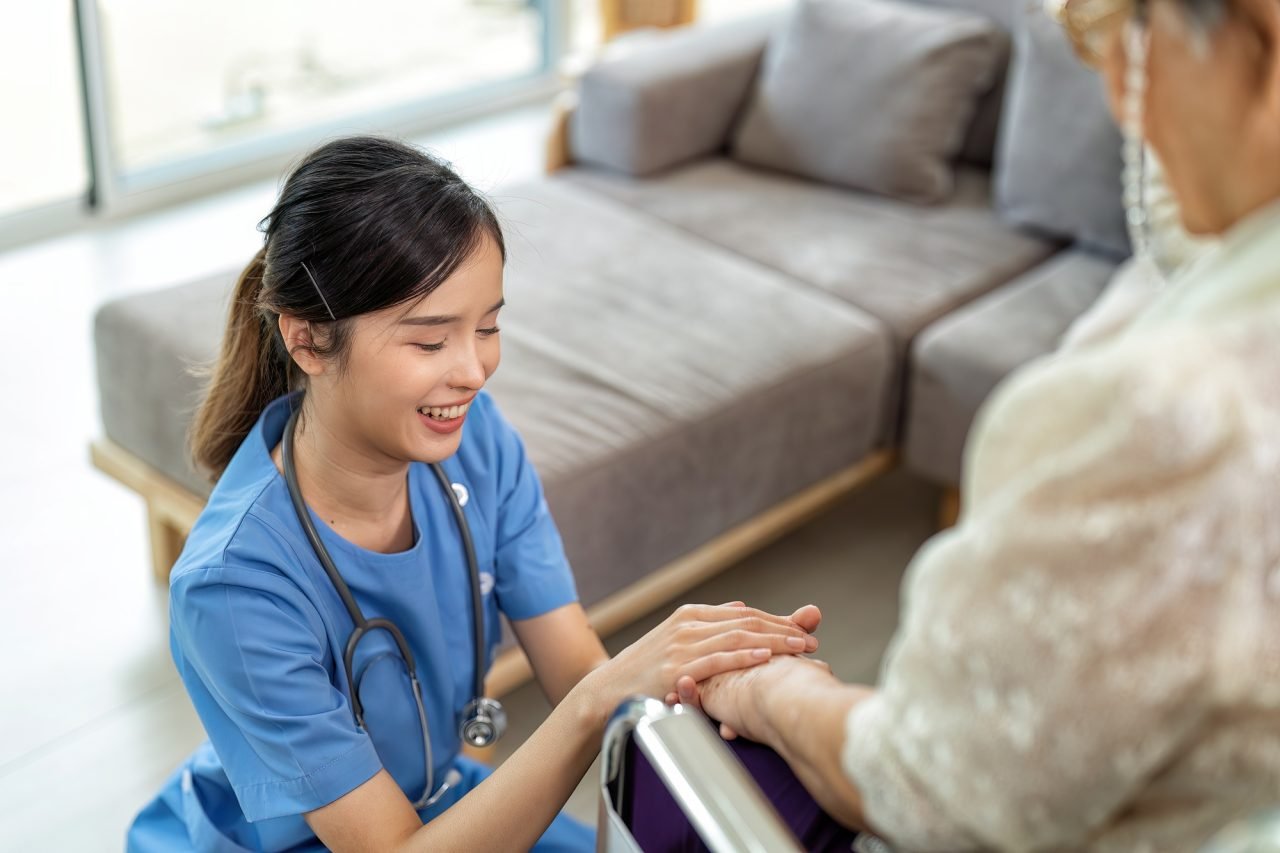 care giving nurse working home care service hold hand aging elderly not too worry boost up morale